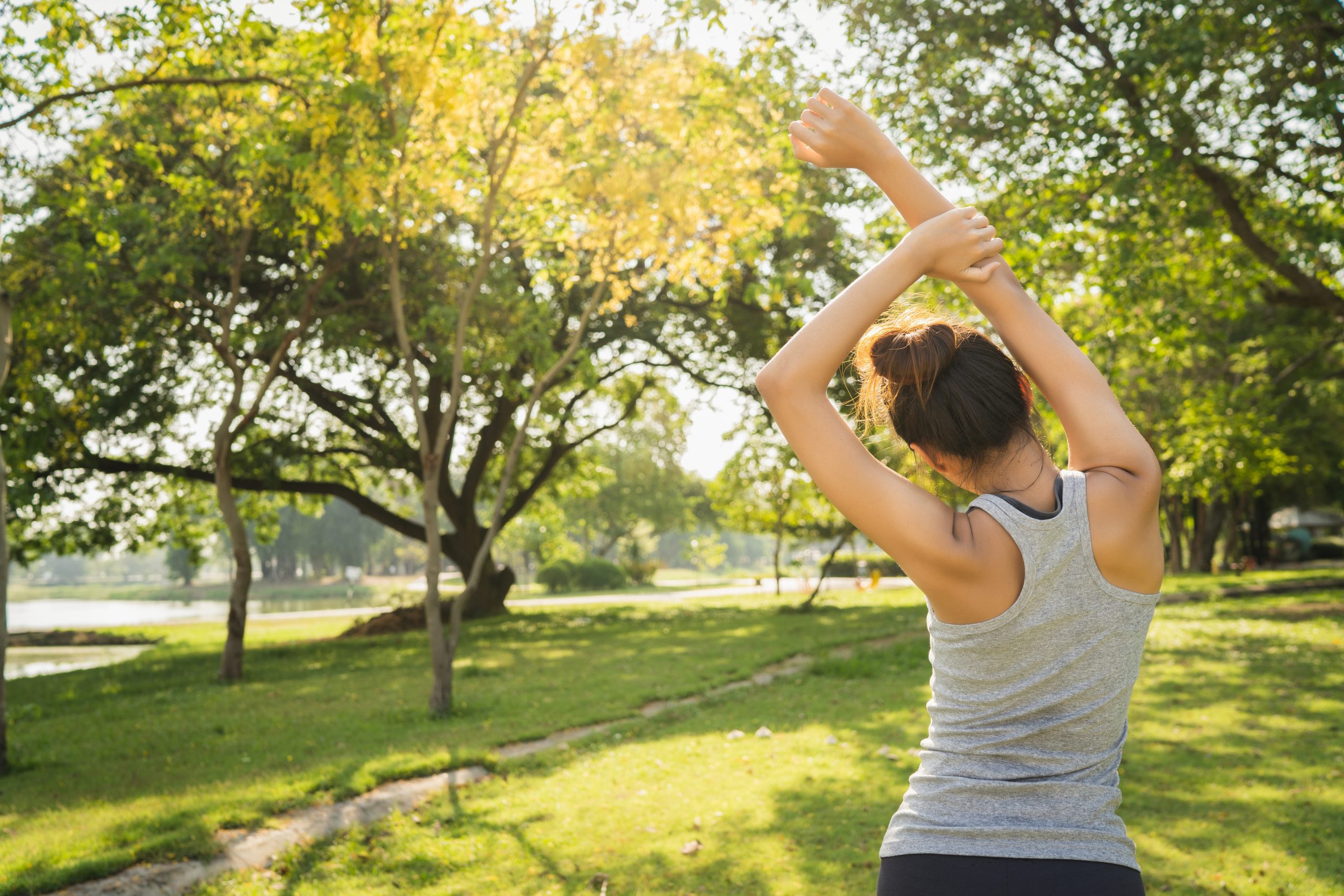 healthy-young-asian-runner-woman-warm-up-the-body-stretching-before-exercise-and-yoga-scaled.jpg